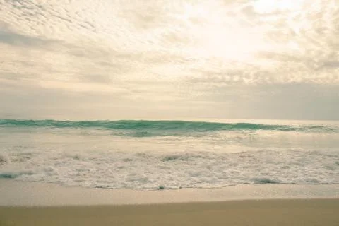 The waves of the sea crashed into the shore Stock Photos