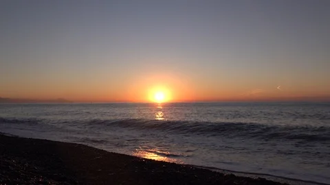 WAVES OF THE SEA AT DAWN ON THE BEACH IN WINTER Stock Footage 100690371