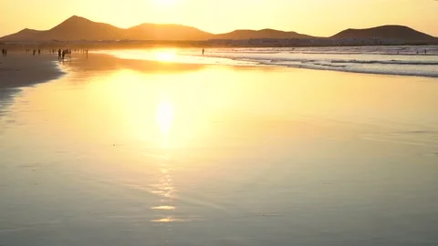 Waves of sea during a beautiful sunset in Famara beach, Lanzarote, Canary Isl Stock Footage 163358475