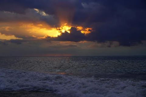 Waves at sea during sunset Stock Photos