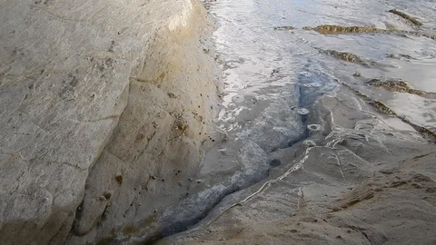Waves of the sea gently caress the cliff 4317 Stock Footage 107399812