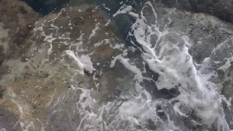 Waves of the sea gently lapping the cliff 4328 Video stock 107400060