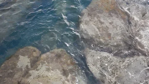 Waves of the sea gently lapping the cliff 4331 Stock Footage 107400268