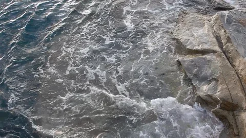 Waves of the sea gently lapping the cliff 4332 Stock Footage 107400288