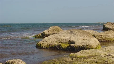 Waves in the sea hit the rocks Stock Footage 113898473