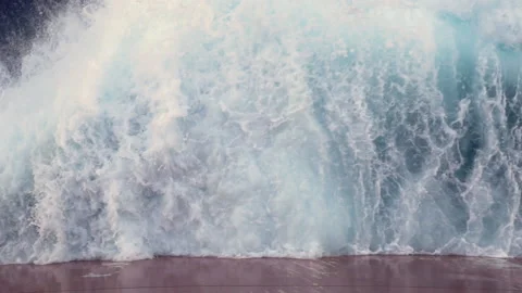 Waves of the sea hit the side of the ship and scatter into the foaming spray. Stock Footage 140745415