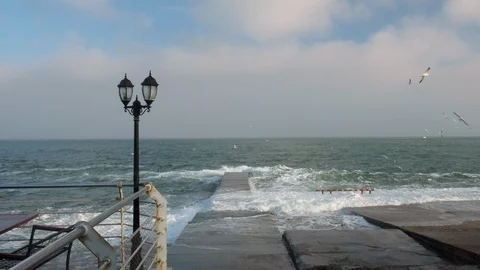 Waves on the sea. Lantern by the sea. Dark clouds over the sea Stock Footage 103334059