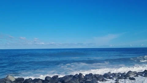 The waves of the sea or ocean break on the rocky coast. Stock Footage 252023044