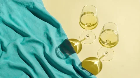 Waves of the sea or ocean sandy beach and two glasses of white wine Stock Footage 220601322