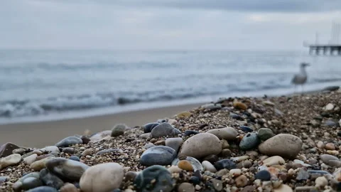 Waves in the sea. A pebble beach. The shore of the sea beach with waves in the Stock Footage 286331123