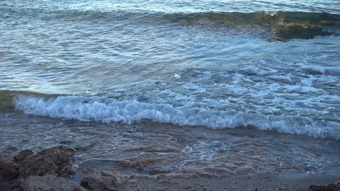Waves of the sea reaching the shore of the beach Stock Footage 124468302