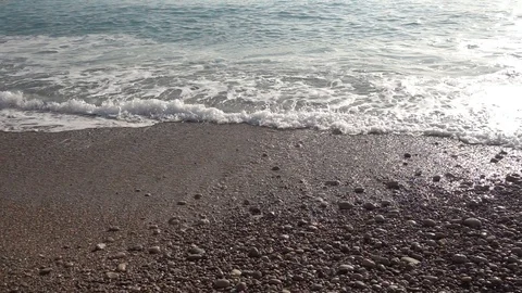 Waves of the sea reaching the shore of the beach Video stock 124469308