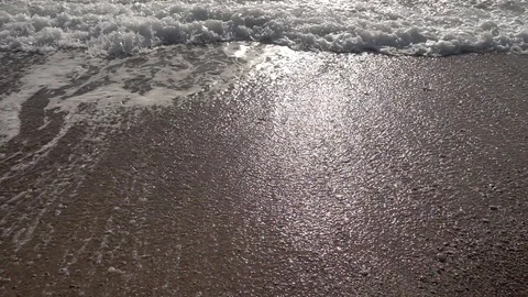 Waves of the sea reaching the shore of the beach Stock Footage 124471200