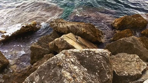 Waves of sea on rock cliff Stock Footage 120826419
