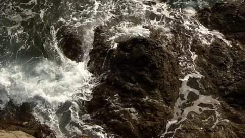 Waves of the sea on rocks Video stock 129700275