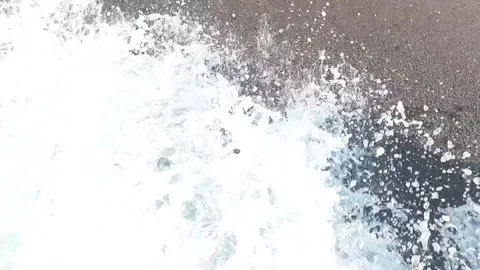 Waves on the sea on a sandy beach, slow motion, splashing water Video stock 250471866
