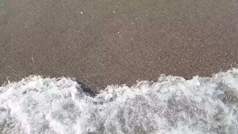 Waves on the sea on a sandy beach, slow motion Video stock 250471867