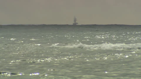 Waves of the sea, with a ship in the background. Stock Footage 39484142