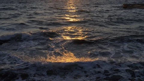 Waves Of The Sea At Sunset And The Reflection Of The Sun Stockbeeldmateriaal 83255815