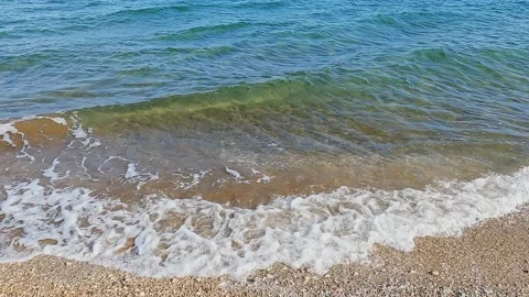 Waves of sea surf on sandy beach Stock Footage 163904239