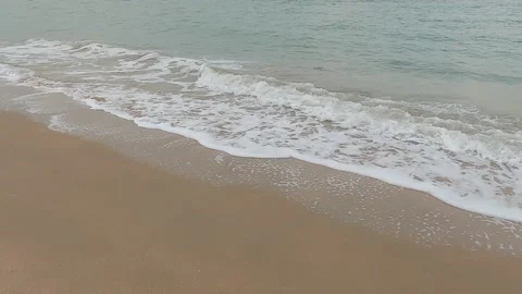 Waves of sea surf on sandy beach, slow motion 動画素材 164985216