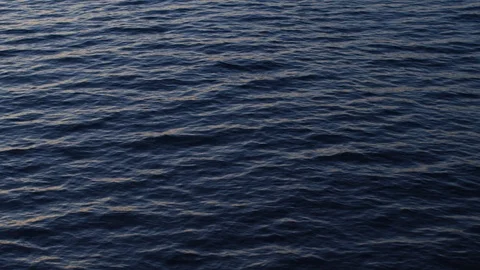 Waves on sea surface at dusk Stock Footage 100046000
