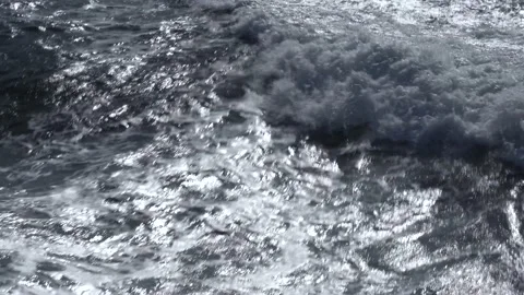 Waves on the sea. View from ship. Rays of the sun from the clouds. Stock Footage 163053193