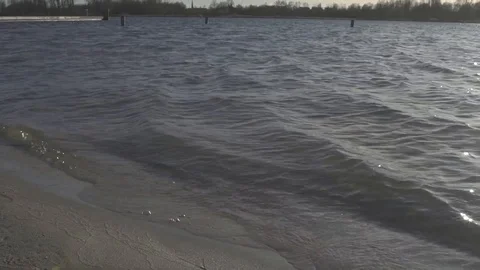 Waves of the sea at the windy cold beach 스톡 동영상 99460006