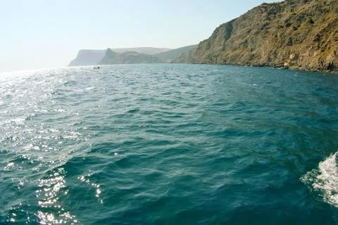 Waves on seascape in sun light Stock Photos