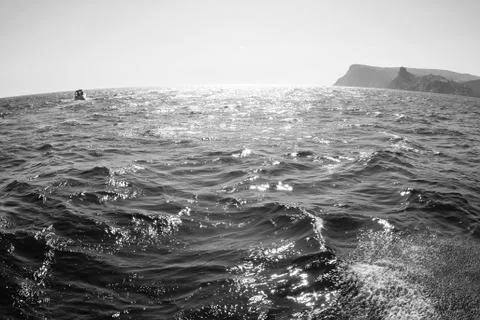 Waves on seascape in sun light Stock Photos