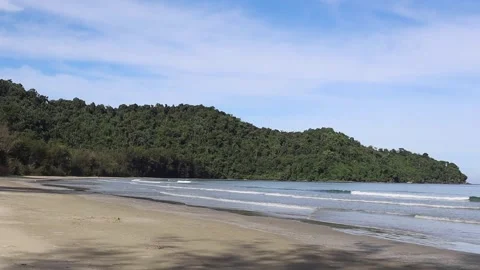 Waves on the seashore on a clear day Stock Footage 339617977