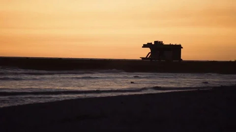Waves on seashore during sunset Stock Footage 77454258