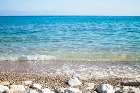 Waves on the seashore with the horizon in the background Stock Photos
