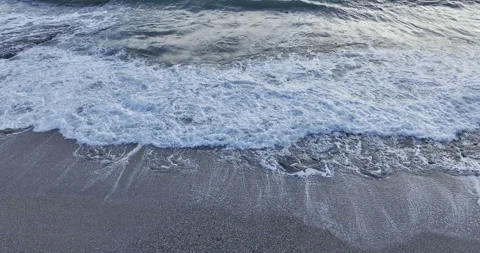 Waves on the seashore looking up Stock Footage 262488951
