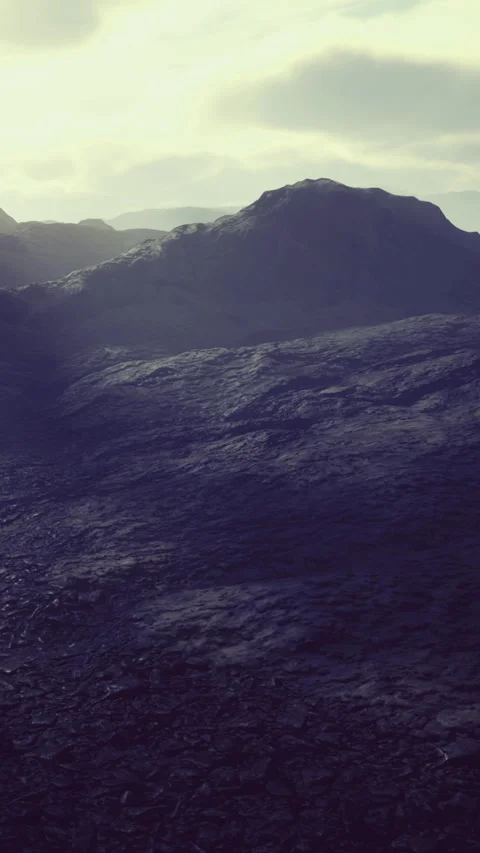 Waves of shadow dance over the rugged terrain of a distant planet at twilight Stock Footage 334257260