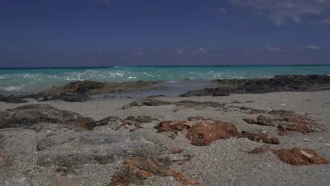 The waves shifting from blue to white truly create a scene of peace Stock Footage 305129359