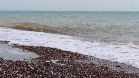 Waves on a shingle beach Stock Footage 132361640