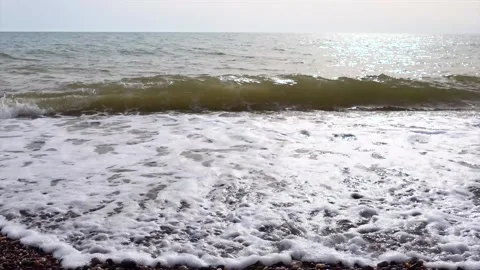 Waves on a shingle beach Stock Footage 132361723