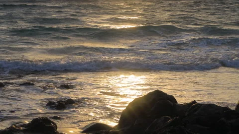 Waves on the shore of the Atlantic Ocean at sunset Stock Footage 304652207