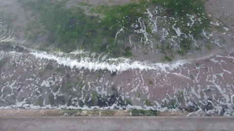 Waves on the shore (Birds eye) Stock Footage 152817352