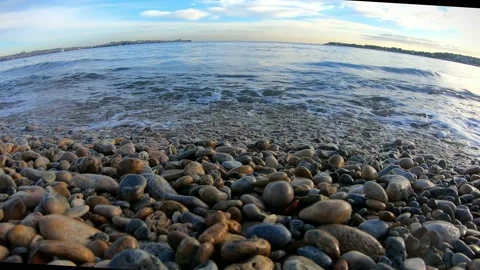 Waves on the shore in front with splashes of water Stock Footage 164896454