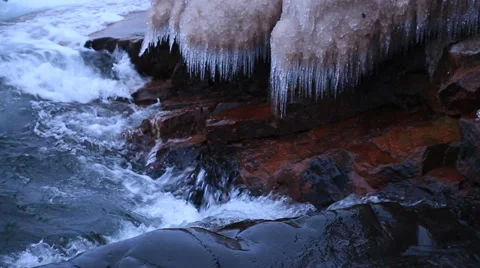 Waves on the shore with icicles Stock Footage 35543800