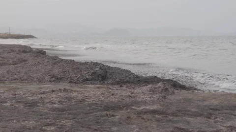 WAVES ON SHORE PEBBLE BEACH Stock Footage 127871186