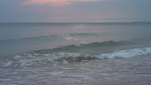 Waves on the shore at sunset Stock Footage 148522600