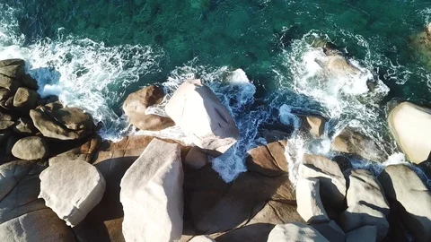 Waves that slam the granite rocks in Sardinia Stock-Footage 101375953