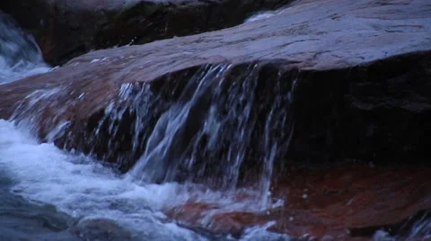 Waves sliding over a rock Stock Footage 37216783