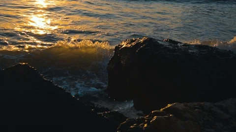 Waves in slow motion under sun rays Stock Footage 102866515