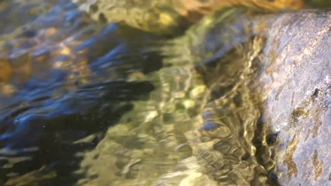 The waves slowly lap against the beach stone Stock Footage 228880482