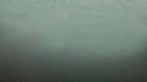 Waves slowly moving into shot Stock Footage 8692583