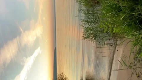 Waves slowly roll on the sandy shore at dawn. The concept of appeasement Video stock 202957444
